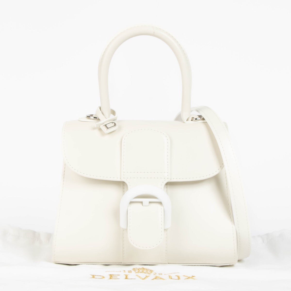 Authentic pre-loved Delvaux Ivory Box Calf Brillant Mini Bag on Labellov.com