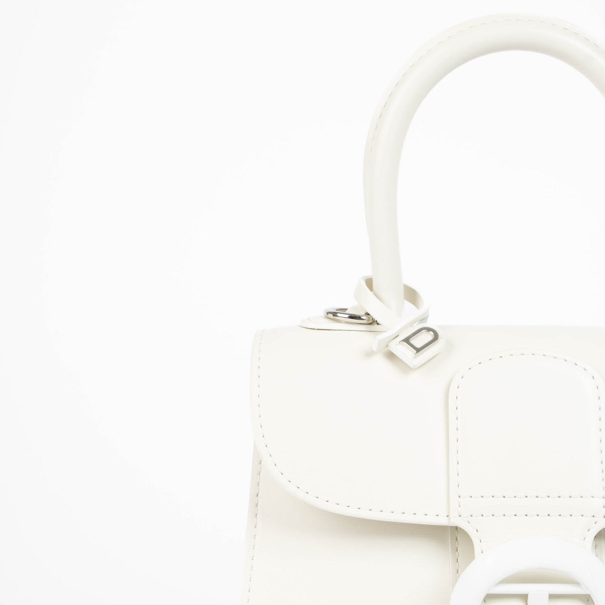 Authentic pre-loved Delvaux Ivory Box Calf Brillant Mini Bag on Labellov.com