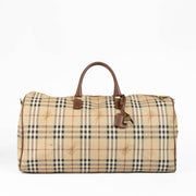Authentic pre-loved Burberry Beige Haymarket Check Duffle Travel Bag on Labellov.com