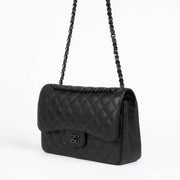 Shop this 100% authentic Chanel Black Crumpled Calfskin Large/Jumbo Classic Flap Bag at Labellov.com