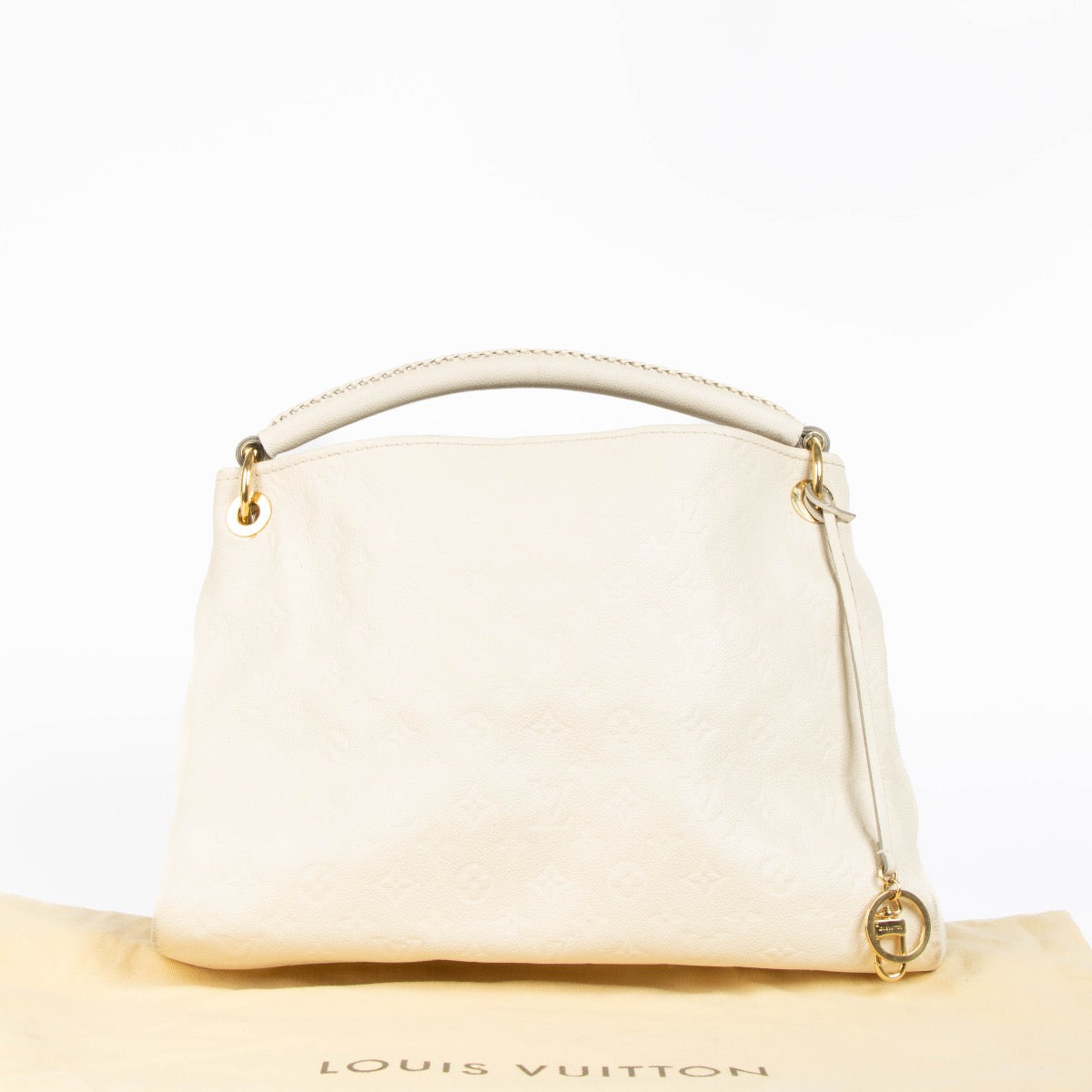Authentic pre-loved Louis Vuitton White Monogram Empreinte Artsy MM Shoulder Bag on Labellov.com