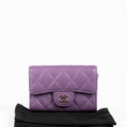 Authentic pre-loved Chanel Purple Quilted Lambskin Flap Card Holder on Labellov.com
