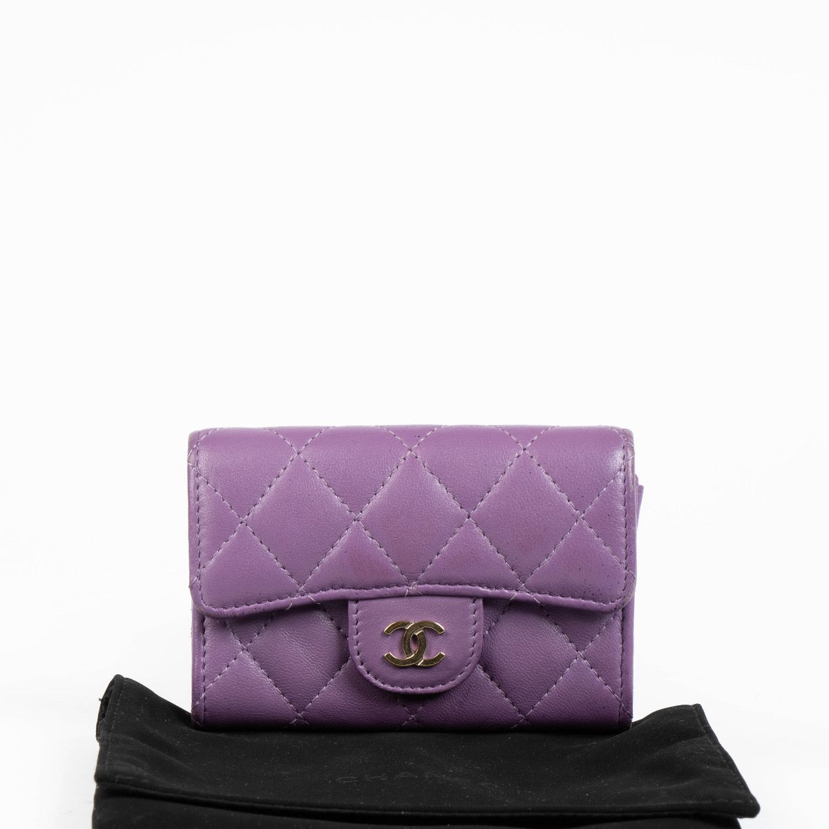 Authentic pre-loved Chanel Purple Quilted Lambskin Flap Card Holder on Labellov.com
