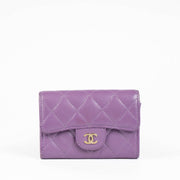 Authentic pre-loved Chanel Purple Quilted Lambskin Flap Card Holder on Labellov.com