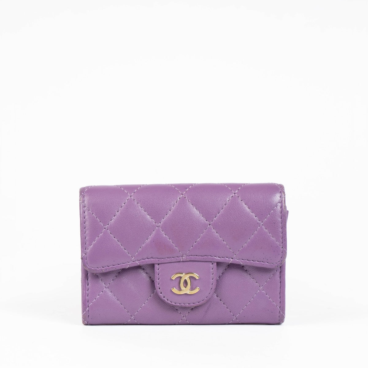 Authentic pre-loved Chanel Purple Quilted Lambskin Flap Card Holder on Labellov.com