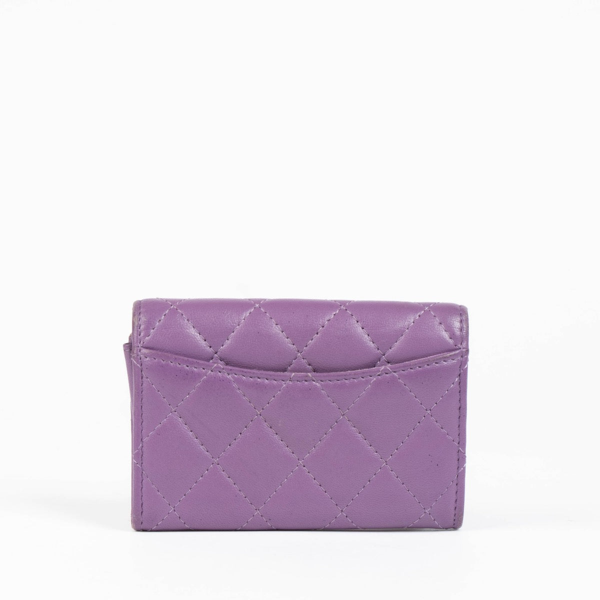 Authentic pre-loved Chanel Purple Quilted Lambskin Flap Card Holder on Labellov.com
