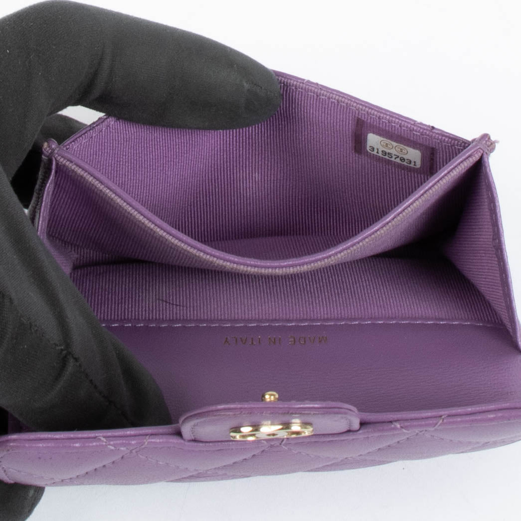 Authentic pre-loved Chanel Purple Quilted Lambskin Flap Card Holder on Labellov.com