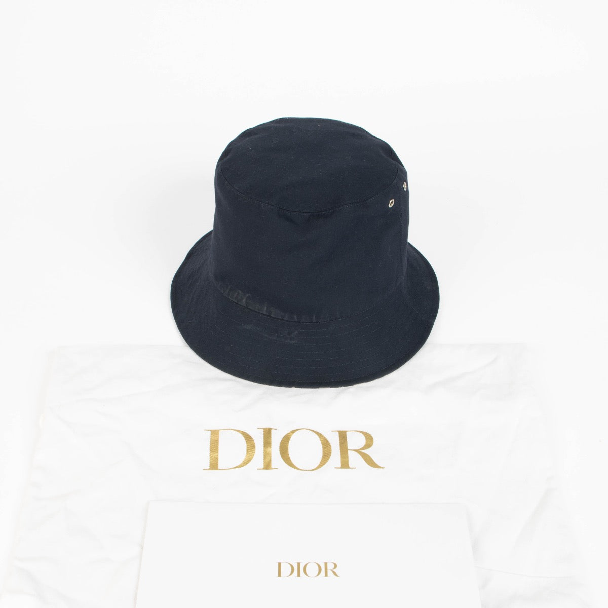 Authentic pre-loved Christian Dior Reversible Teddy D Bucket Hat on Labellov.com