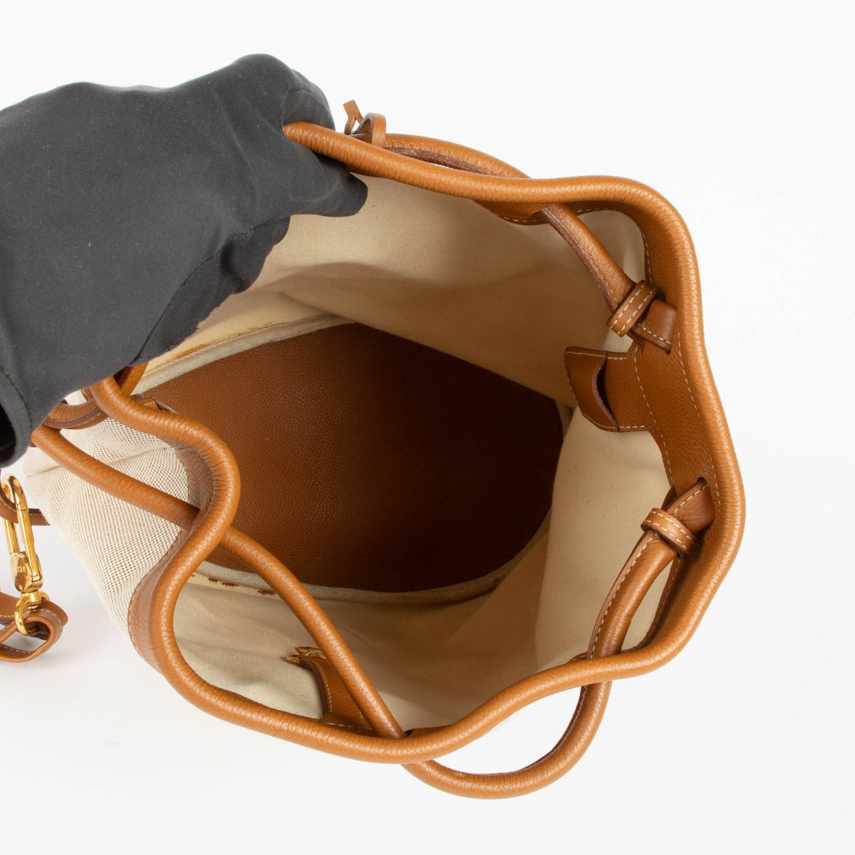 Shop this 100% authentic Delvaux Beige Canvas Pierre de Lune Bucket Bag at Labellov.com