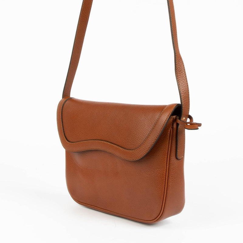 Shop this authentic Delvaux Tan Crossbody Flap Bag pre-loved on Labellov.com