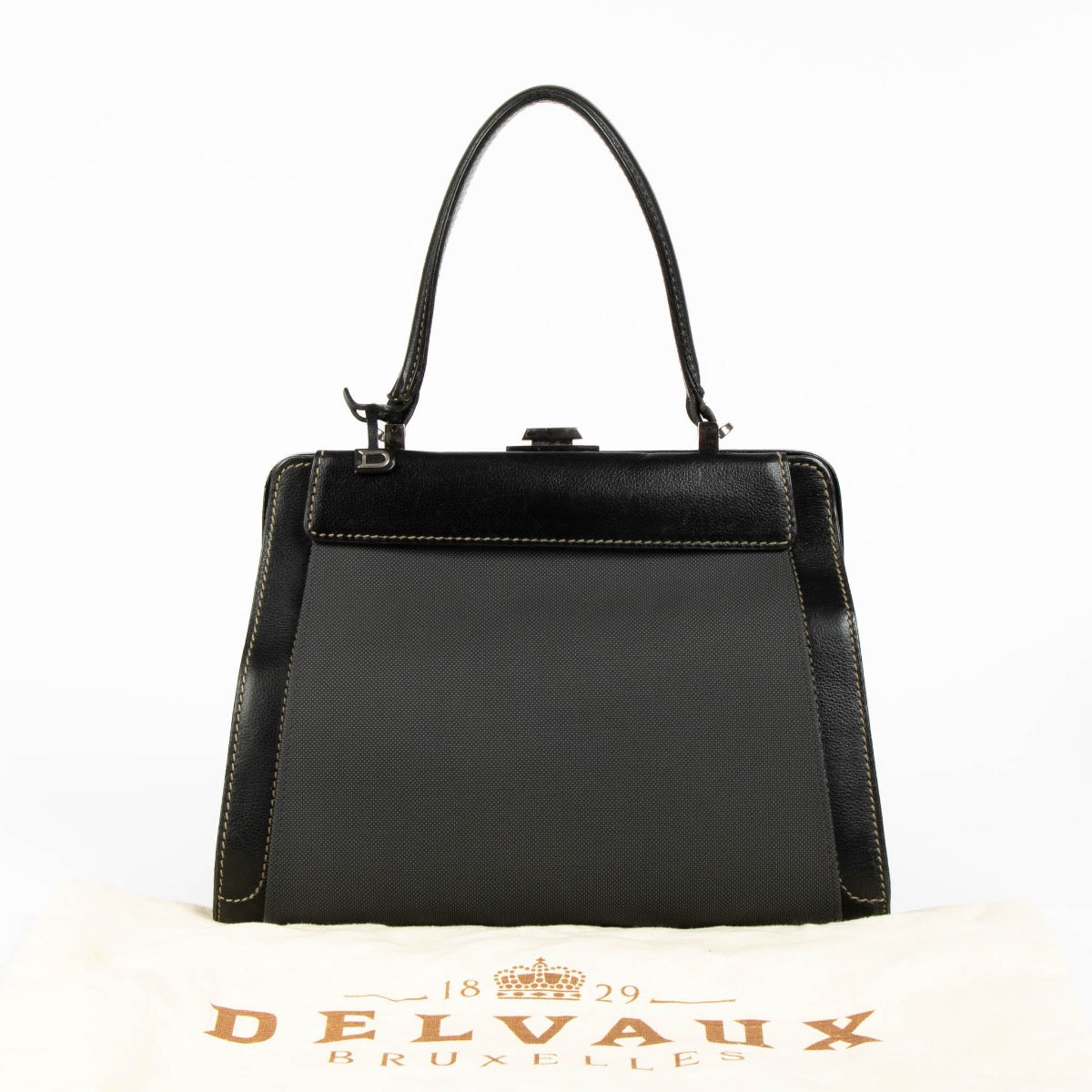 Authentic pre-loved Delvaux Black Illusion Jumping Top Handle Bag on Labellov.com