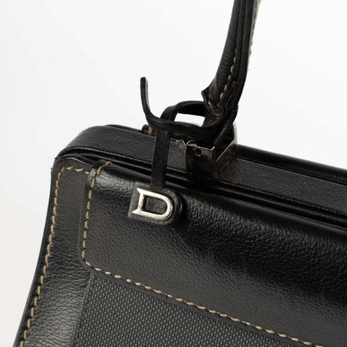Authentic pre-loved Delvaux Black Illusion Jumping Top Handle Bag on Labellov.com