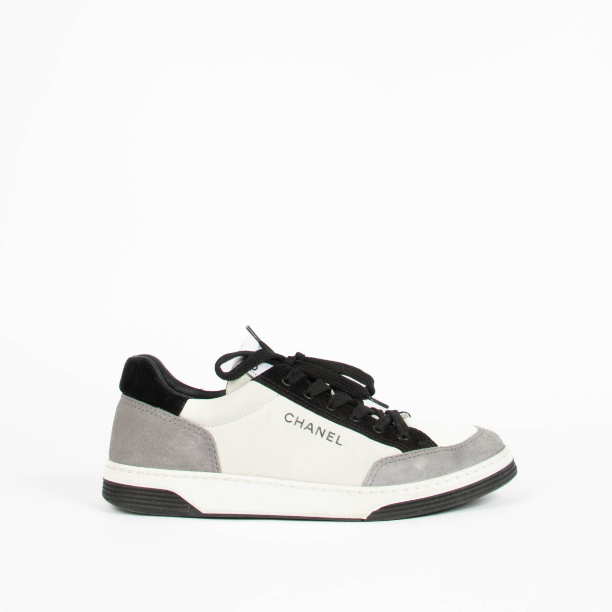 Shop this 100% authentic Chanel Grey Black Sneakers in size 39 at Labellov.com