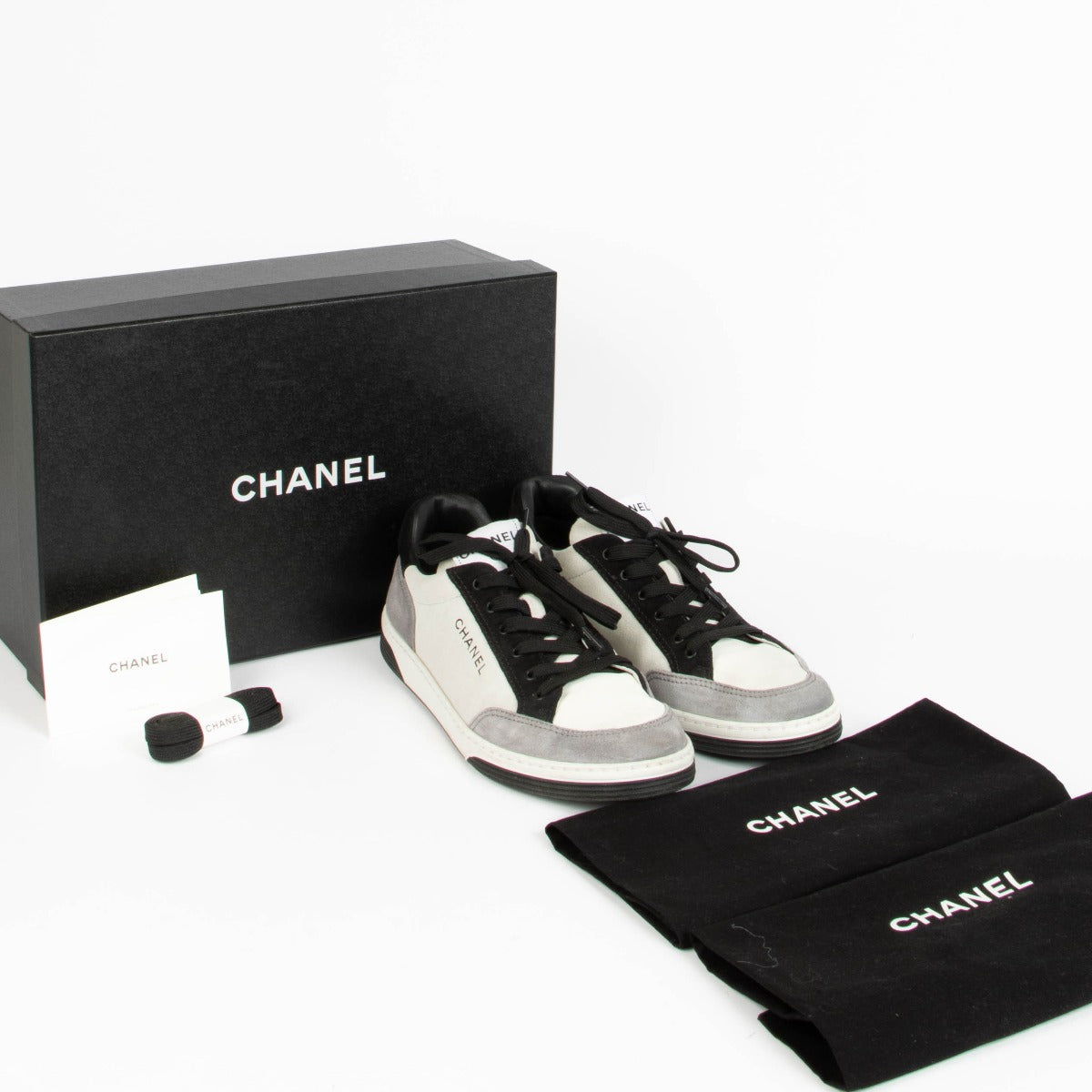 Shop this 100% authentic Chanel Grey Black Sneakers in size 39 at Labellov.com