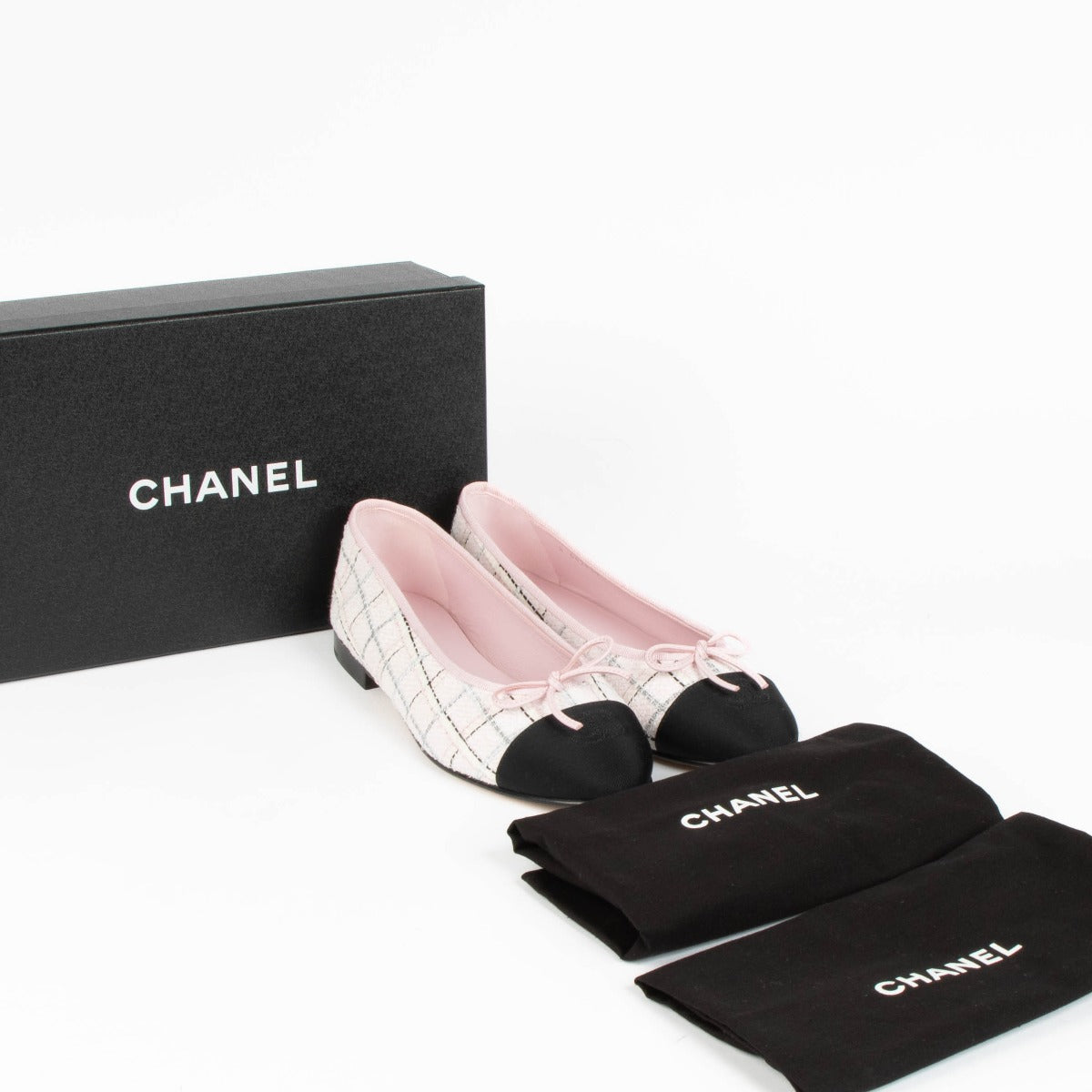 Shop this 100% authentic Chanel Pink Tweed Ballet Flats in size 39 at Labellov.com