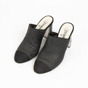 100% authentic Chanel Black Glitter Cap Toe Mules in size 39 with subtle glitter finish and iconic cap toe design.