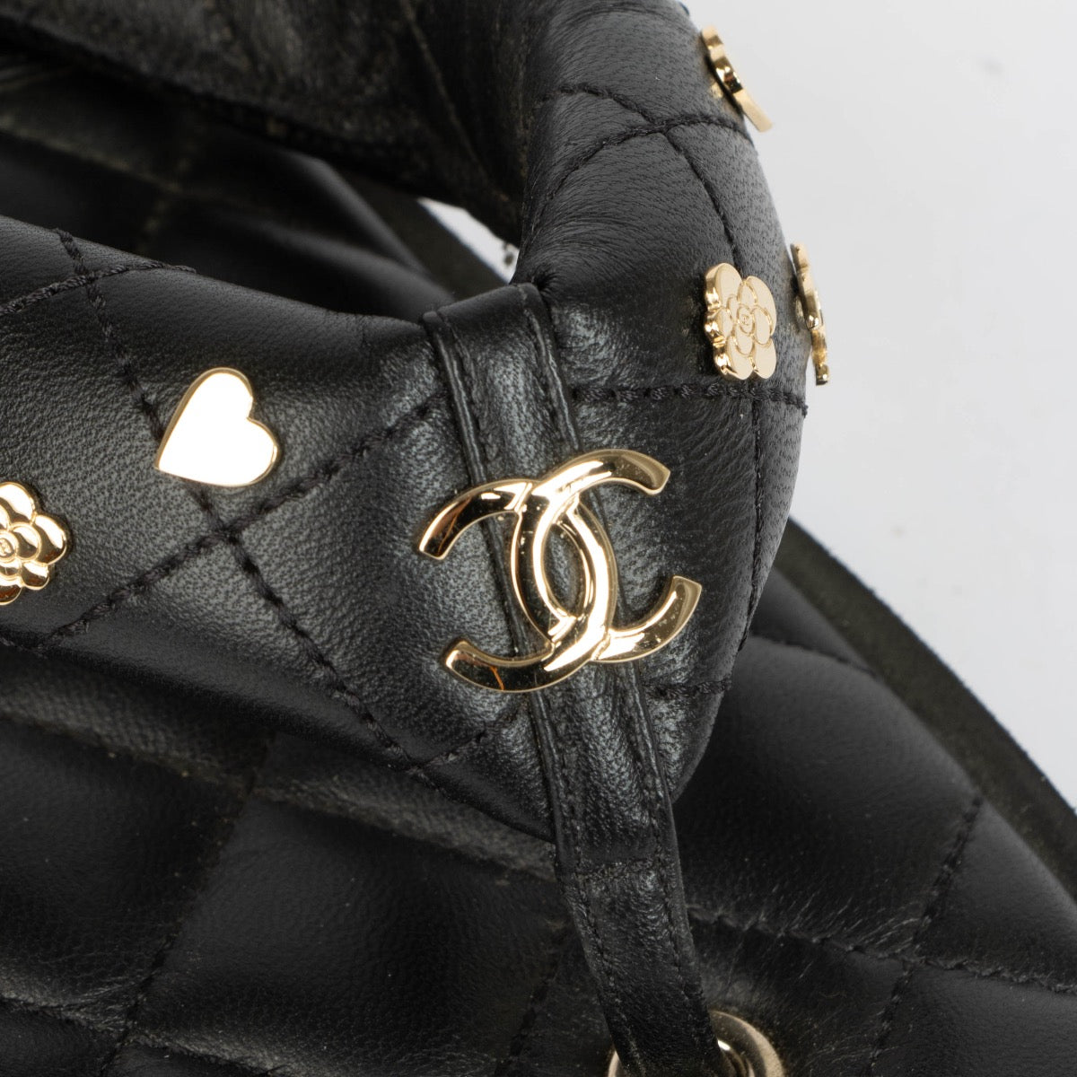 Authentic pre-loved Chanel Black Quilted Charms Thong Sandals -Size 38.5 on Labellov.com