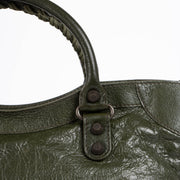 Authentic pre-loved Balenciaga Green Arena Medium City Top Handle Bag on Labellov.com