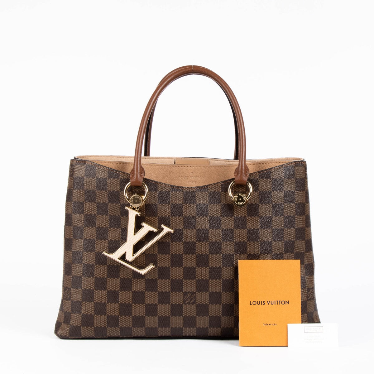Authentic pre-loved Louis Vuitton Damier Ebene Riverside Top Handle Bag on Labellov.com