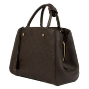 Shop safe online at Labellov in Antwerp, Brussels and Knokke this 100% authentic second hand Louis Vuitton Terre Monogram Empreinte Montaigne MM Top Handle Bag in very good condition.