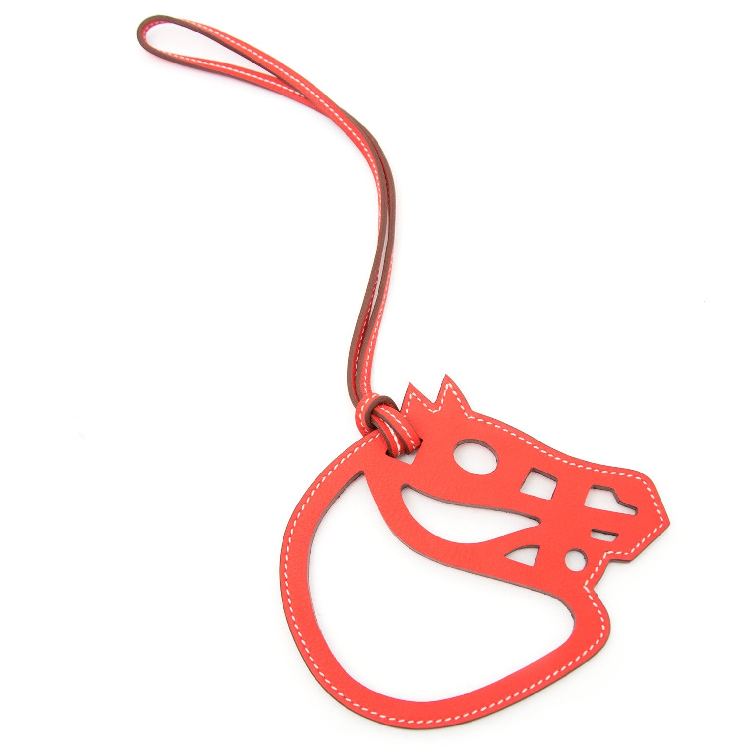 Vintage Hermès red horse leather ornament for the best price at Labellov webshop. Safe and secure online shopping with 100% authenticity. Vintage Hermes rouge cheval ornament en cuir pour le meilleur prix.