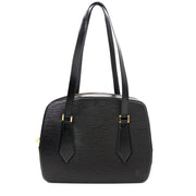 koop veilig online aan de beste prijs Elegant shoulder bag for everyday use. On the outside is an open slip in pocket and top is secured with double brass zipper. Inside is brown alkantra lining and with one open pocket.