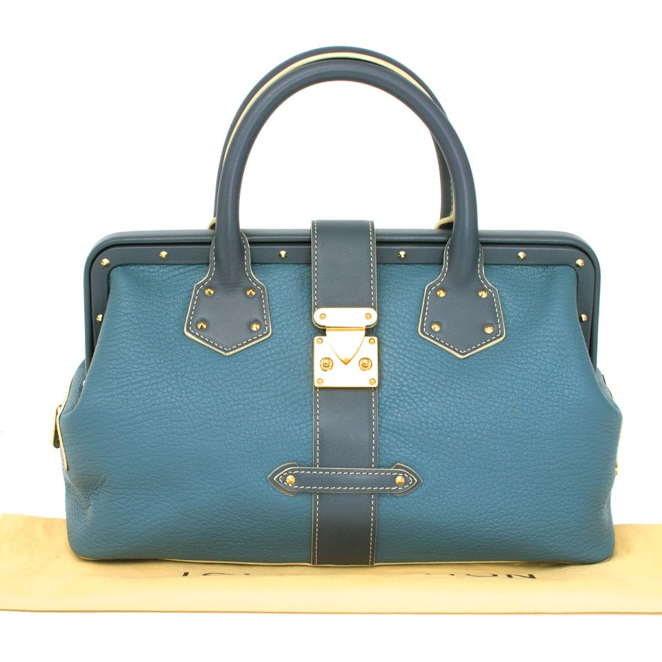 Authentieke Louis Vuitton l'ingenieux blauw dokterstas voor de juiste prijs bij LabelLOV vintage webshop. Louis Vuitton Suhali L'ingenieux bicolor blue shoulder bag.Veilig online winkelen. Luxe, vintage, mode. Antwerpen, België.