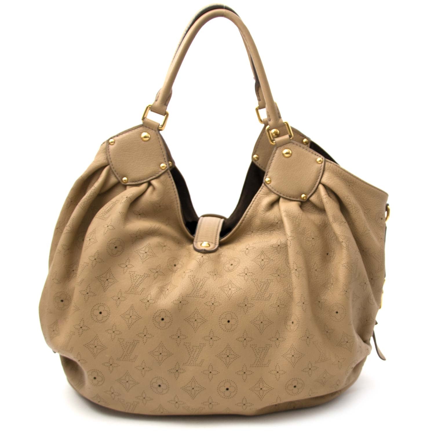 Louis Vuitton Mahina Beige Leather Perforated Monogram Large Hobo Bag Buy authentic designer Louis Vuitton secondhand bags at Labellov at the best price. Safe and secure shopping. Koop tweedehands authentieke Vuitton tassen bij designer webwinkel labellov