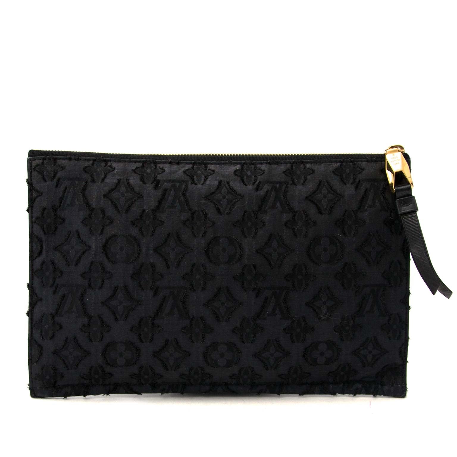 Are you looking for an authentic Louis Vuitton Limited Edition Monogram Fabric Clutch Pochette?