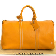 acheter en ligne seconde main Louis Vuitton Keepall Tobago Yellow Runway Travel Bag