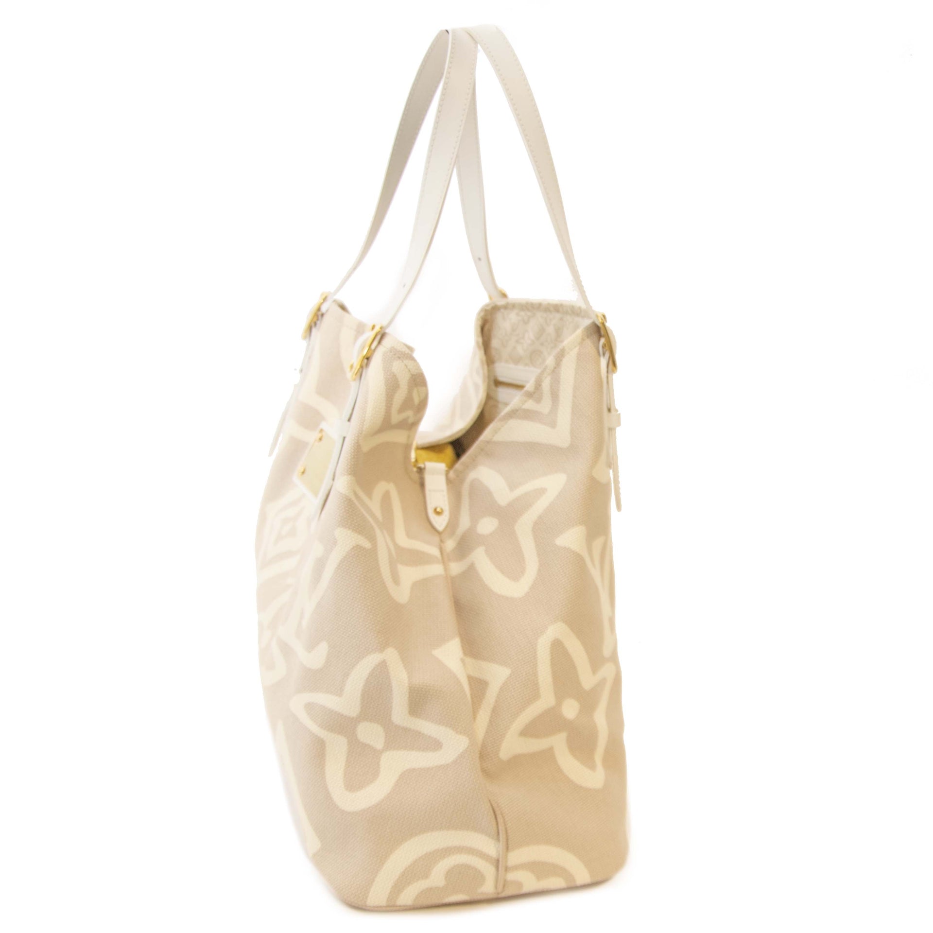 Louis Vuitton Tahitienne Beige Canvas Tote Bag. Buy authentic Louis Vuitton Limited Collection Tahitienne bag. Secure payment. Koop authentieke Louis Vuitton beachbag bij Labellov. Acheter authentique sac à main de Louis Vuitton. Paiement Securisé