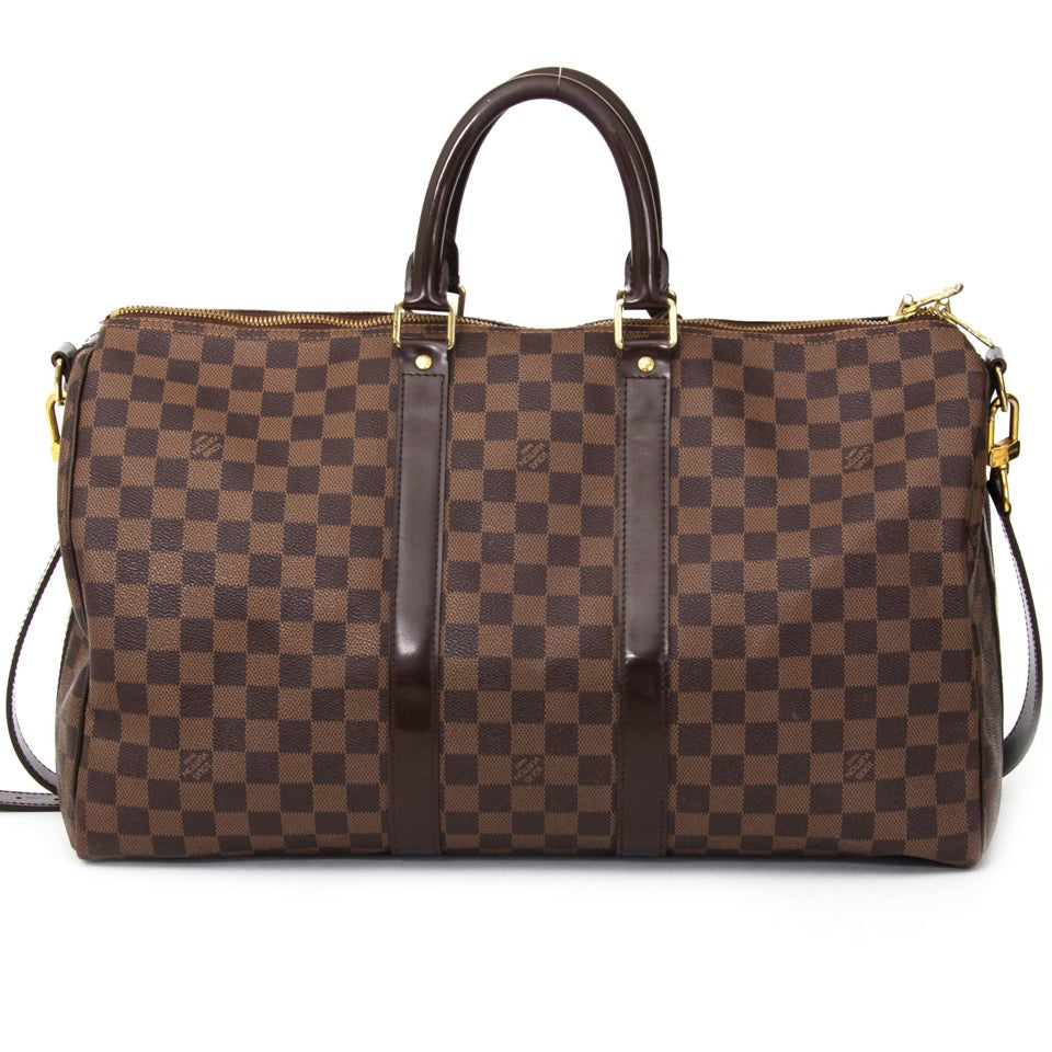 Buy Louis Vuitton Keepall 45 and shoulder strap at the right price at LabelLOV vintage webshop. Luxe, vintage, fashion. Safe and secure online shopping. Antwerp, Belgium.