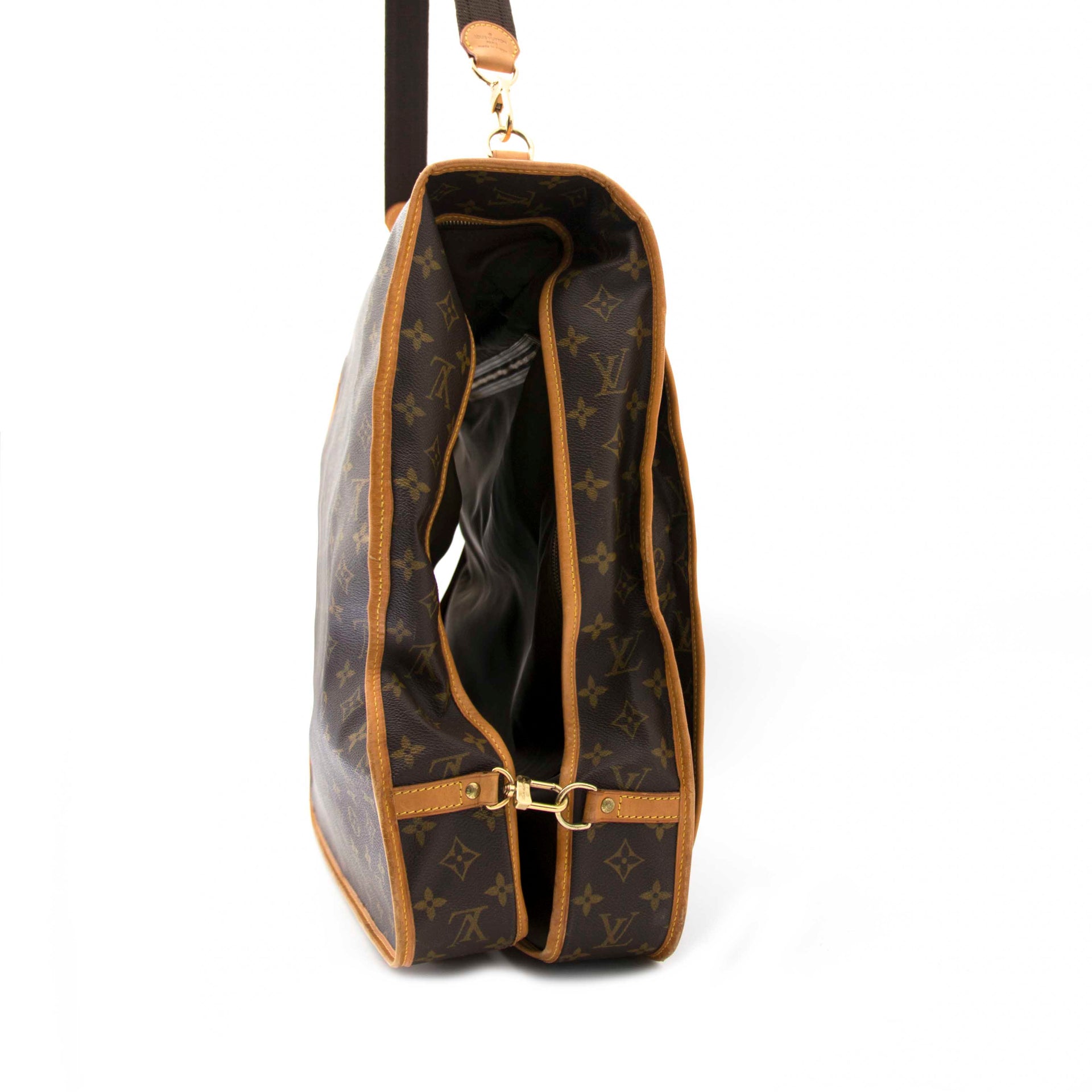 The Louis Vuitton Monogram Canvas Portable Bandouliere Garment Bag is now for sale with worldwide shipping and at affordable prices, iconic Louis Vuitton pieces for sale.