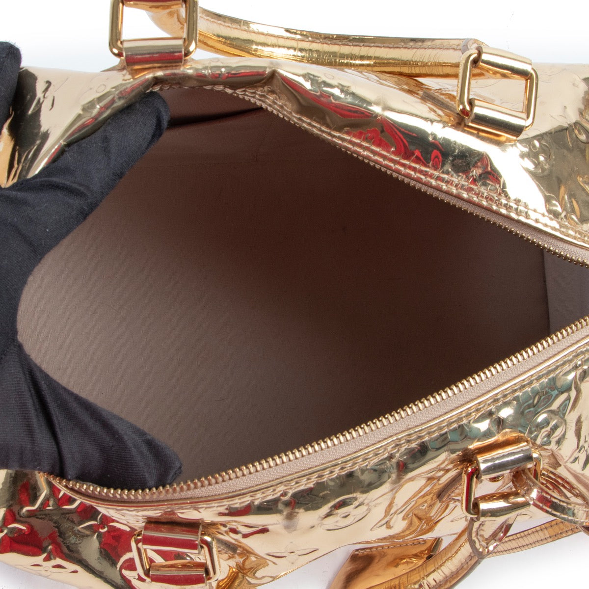 Original Louis Vuitton Gold Metallic Top-handle bag in very good condition for sale on Labellov vintage site.