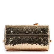 Original Louis Vuitton Gold Metallic Top-handle bag in very good condition for sale on Labellov vintage site.