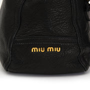 Buy Miu Miu black top handle bag with gold toned hardware at the right price at LabelLOV vintage webshop. Luxe, vintage, fashion. Safe and secure online shopping. Antwerp, Belgium.