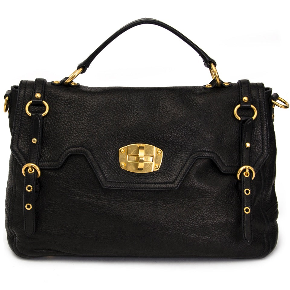 Buy Miu Miu black top handle bag with gold toned hardware at the right price at LabelLOV vintage webshop. Luxe, vintage, fashion. Safe and secure online shopping. Antwerp, Belgium.