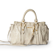 Miu Miu Vitello Lux Cream authentic designer bag. Buy safely online on Labellov.com