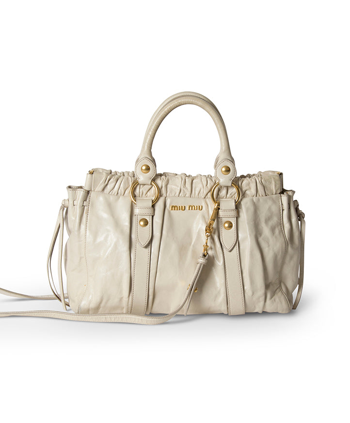Miu Miu Vitello Lux Cream authentic designer bag. Buy safely online on Labellov.com