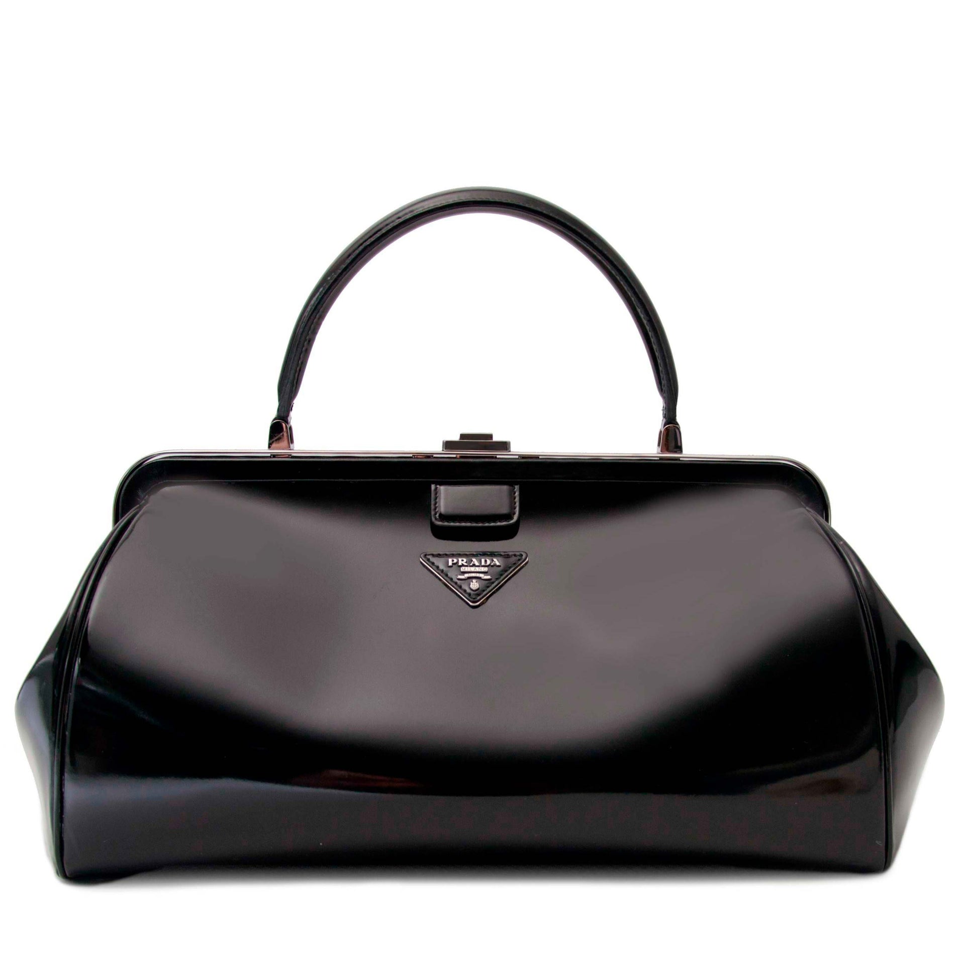 Prada Black Patent Bowling Bag Buy authentic designer Prada secondhand bags at Labellov at the best price. Safe and secure shopping. Koop tweedehands authentieke Prada tassen bij designer webwinkel labellov.