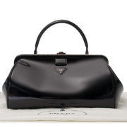 Prada Black Patent Bowling Bag Buy authentic designer Prada secondhand bags at Labellov at the best price. Safe and secure shopping. Koop tweedehands authentieke Prada tassen bij designer webwinkel labellov.