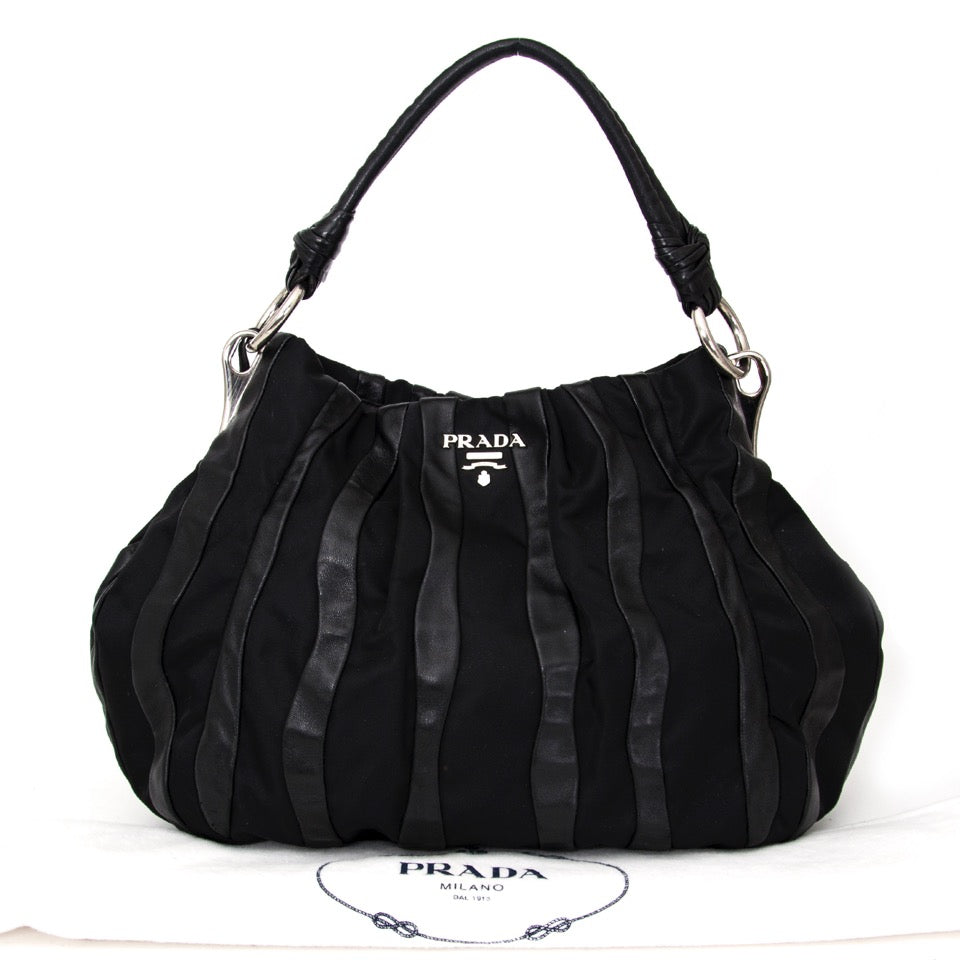 Buy Prada Black Shoulder Bag Leather and nylon at the right price at LabelLOV vintage webshop. Luxe, vintage, fashion. Safe and secure online shopping. Antwerp, Belgium.