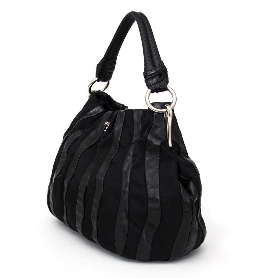 Buy Prada Black Shoulder Bag Leather and nylon at the right price at LabelLOV vintage webshop. Luxe, vintage, fashion. Safe and secure online shopping. Antwerp, Belgium.