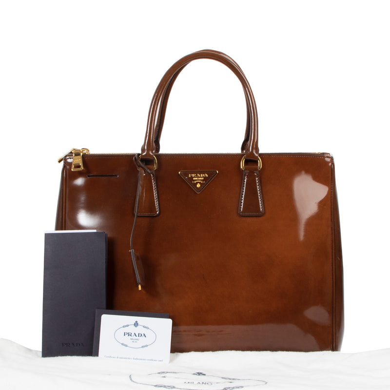 Shop now for your pre-loved, 100% authentic Prada Brown Patent Leather Large Galleria Top Handle Bag, at Labellov in Antwerp