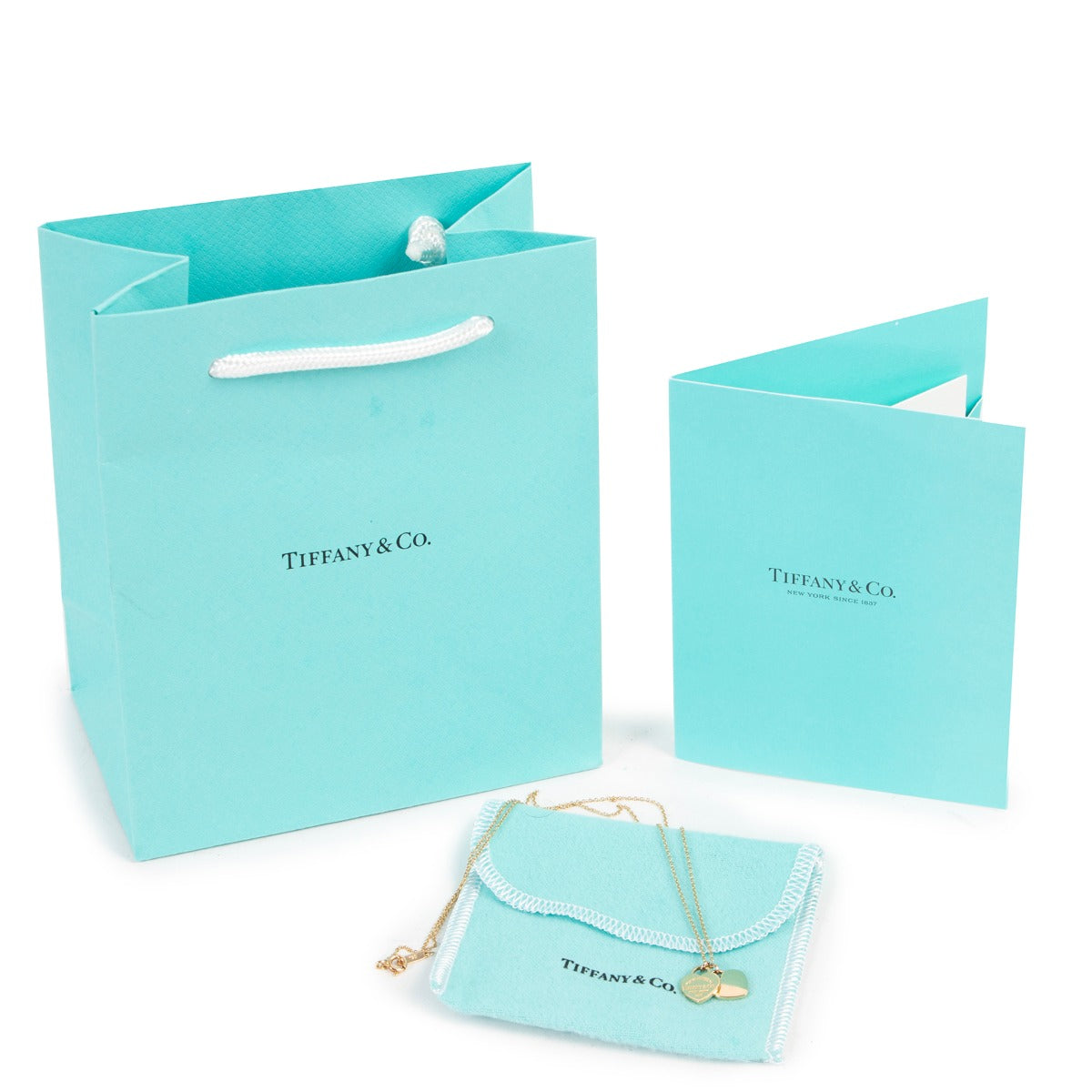 Get this Tiffany & Co Mini Double Heart Tag Pendant Yellow Gold at Labellov for a reasonable price online or in store.