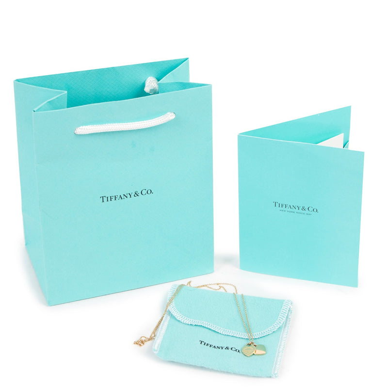 Get this Tiffany & Co Mini Double Heart Tag Pendant Yellow Gold at Labellov for a reasonable price online or in store.