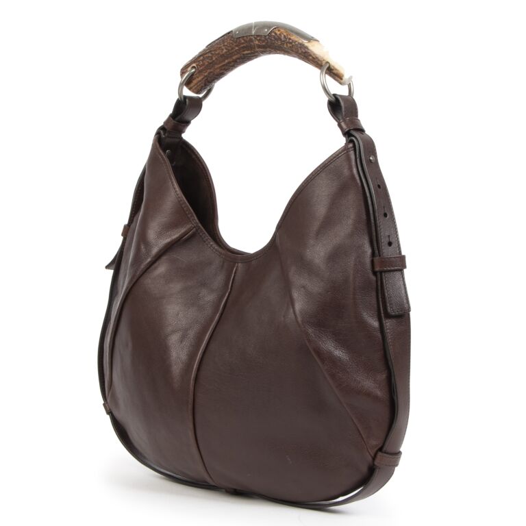 An Authentic Yves Saint Laurent Leather Mombasa Vincennes Gilt Metal Horn  shaped Handbag Bag