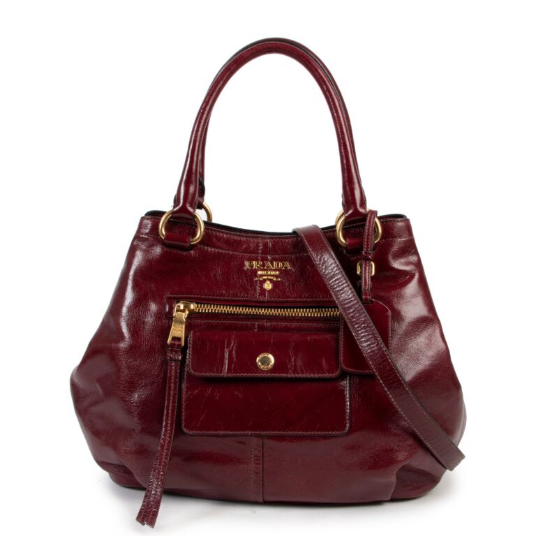 Prada Black Designer handbag/shoulder bag. Love the pop of red on