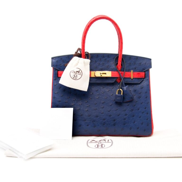 ✨Ultra-Rare✨ This Baby Birkin features two beautiful colors in Rouge  Sellier & Bleu Saphir Ostrich. An incredibly unique handbag available…