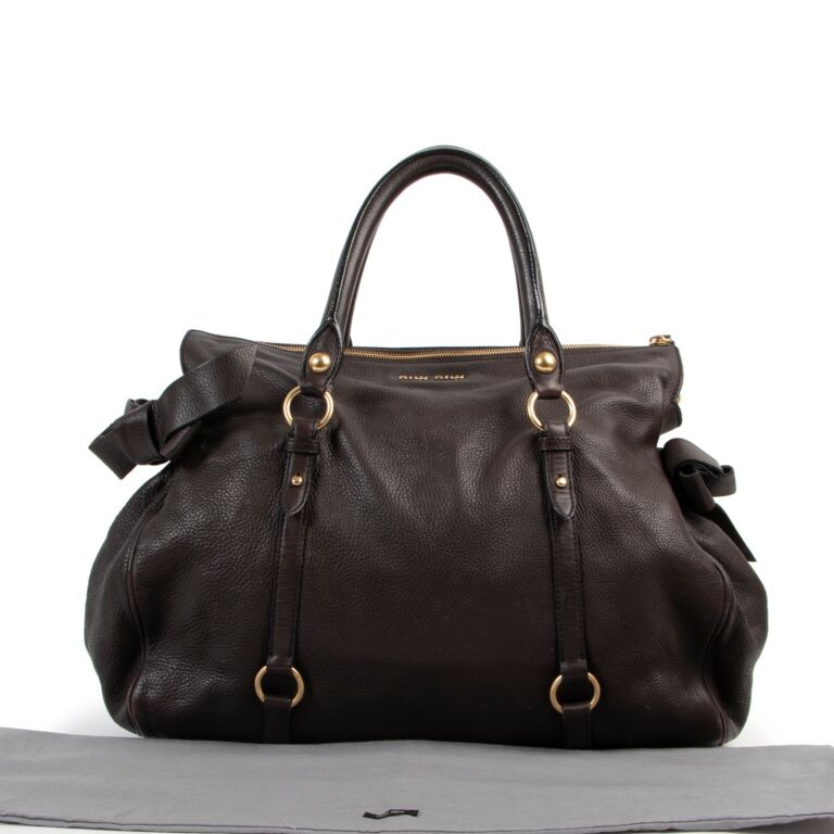 Sold at Auction: Vintage Miu Miu Shoulder Bag, Brown Leather with Gilt  accents, Double Zipper Closure; Overall length 17, Double Strap length  10, Bag Ht. 7 W. 16 D. 5; Good condition